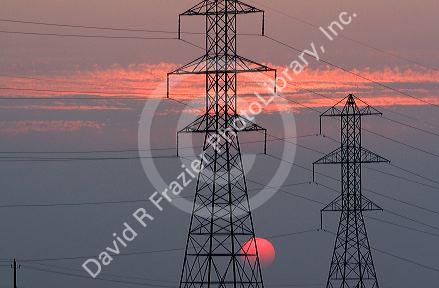 High voltage electric transmission lines at sunset in Boise, Idaho.