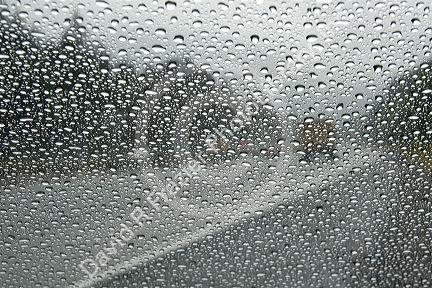 Raindrops on the windshield of a car in Washington.
