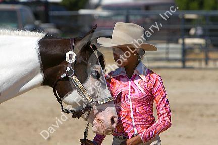 Girl showing her Pinto horse to 4-H judges at the Western Idaho Fair in Boise, Idaho.