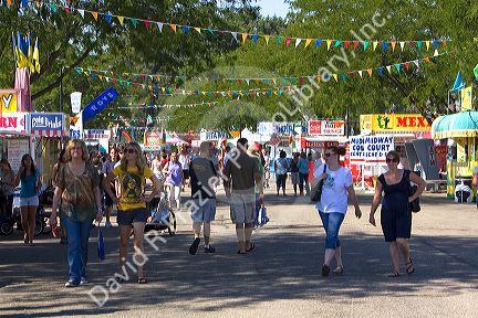 People walk amongst food stands at the Western Idaho Fair in Boise, Idaho.