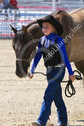Girl showing her 4-H blue ribbon winning horse at the Western Idaho Fair in Boise, Idaho.