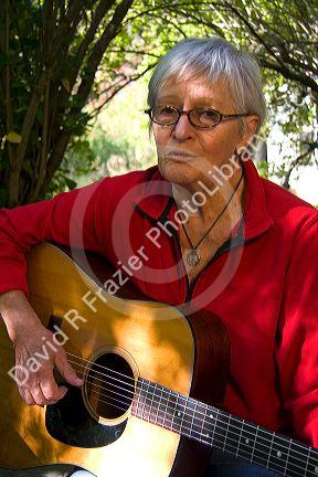 American folk singer-songwriter Rosalie Sorrels playing guitar at her home near Boise, Idaho. MR