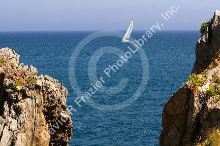 Sailboat entering the harbor at Castro Urdiales, Cantabria, northern Spain.
