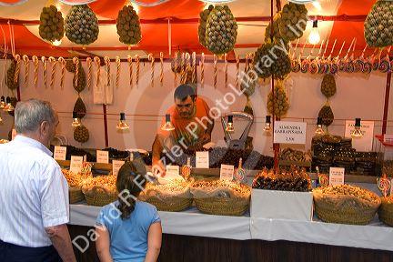 Vendor selling nuts and candy in the town of Ribadesella, Asturias, northern Spain.