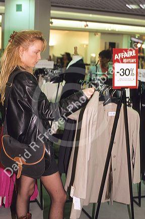 Woman shopping at Printemps in Paris, France.