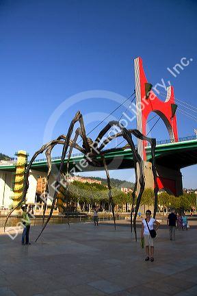 Large spider sculpture Maman by Louise Bourgeois next to La Salve Bridge in front of the Guggenheim Museum in Bilbao, Biscay, Basque Country, northern Spain.