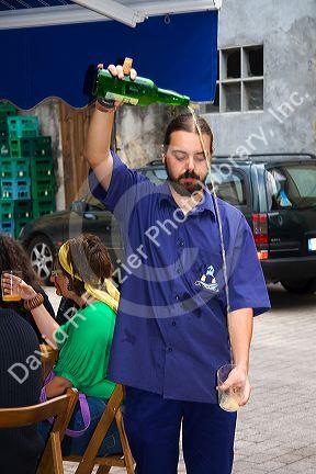 Server pouring cider at a cidereria in the town of Ribadesella, Asturias, northern Spain.