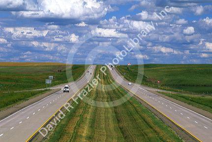 Automobiles travel on Interstate 90 through South Dakota.