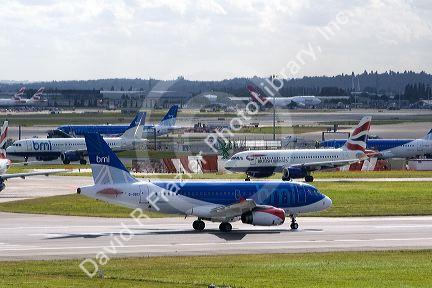 Airliners on the runway at London Heathrow Airport, England, United Kingdom.