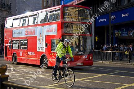 Double decker bus and bicyclist in London, England.
