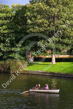 People in a row boat on the River Avon at Stratford-upon-Avon, Warwickshire, England.