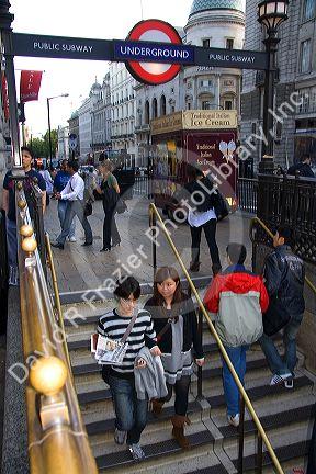 People entering and exiting the London Underground metro system in the city of London, England.