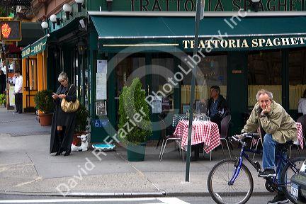 Bicyclist on west 4th and 6th Aveneues in lower Manhattan, New York City, New York, USA.