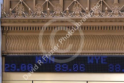 Ticker in front of the New York Stock Exchange in New York City, New York, USA.