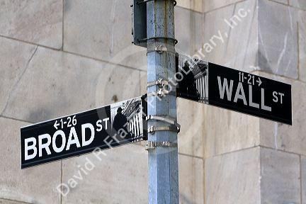 Street sign for Wall and Broad in New York City, New York, USA.