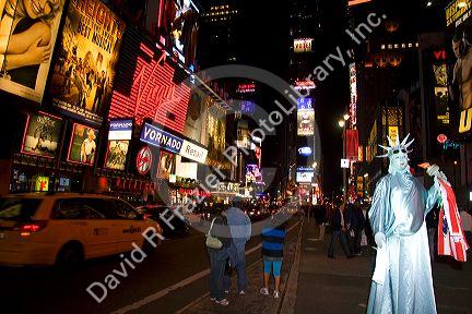 Times Square at night in Manhattan, New York City, New York, USA.