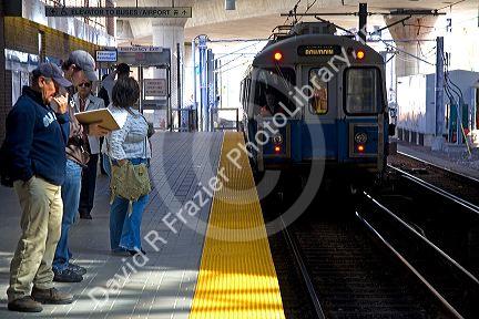 Passengers wait on the platform for the MBTA Blue Line subway in Boston, Massachusetts, USA.