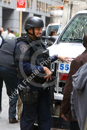 New York City Police Department Emergency Services Unit officer on Wall Street in New York City, New York, USA.