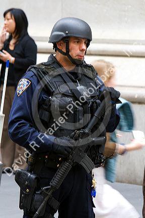 New York City Police Department Emergency Service Unit officer on Wall Street in New York City, New York, USA.