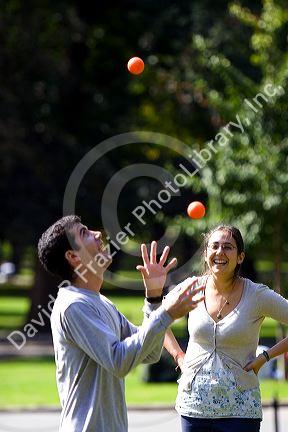 A man toss juggling balls in Boston Common public park in Boston, Massachusetts, USA. MR
