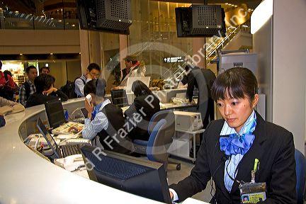 Ticket agent for All Nippon Airways at the Narita International Airport, Tokyo, Japan.