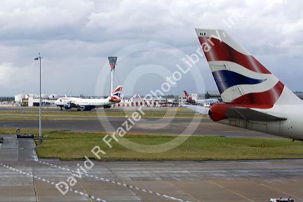 Airliners on the runway at London Heathrow Airport, England, United Kingdom.