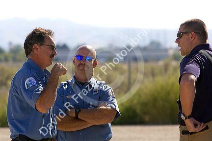Firefighters taking direction from a training officer at an airport training facility in Boise, Idaho, USA.
