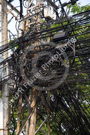 A tangle of telephone wires on a utility pole in Ho Chi Minh City, Vietnam.