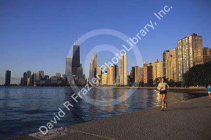 A woman going for a jog on the Chicago lake front, Illinois.