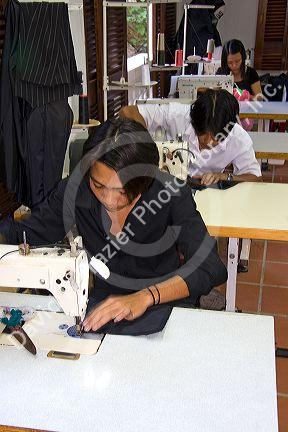 Workers sewing at the Yaly clothing factory in Hoi An, Vietnam.