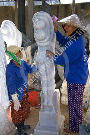 Vietnamese women carving marble sculptures at a shop in Ngu Hanh Son ward south of Da Nang, Vietnam.