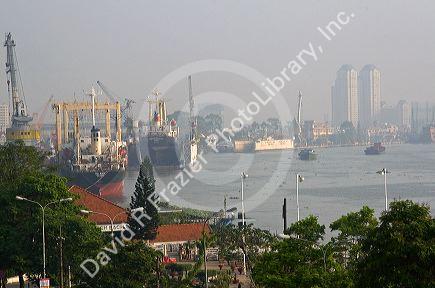 Activity on the Saigon River on hazy polluted day in Ho Chi Minh City, Vietnam.