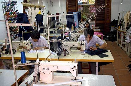 Workers sewing at the Yaly clothing factory in Hoi An, Vietnam.