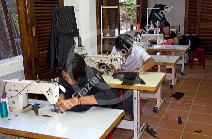 Workers sewing at the Yaly clothing factory in Hoi An, Vietnam.