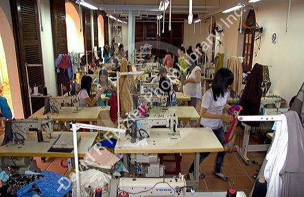 Workers sewing at the Yaly clothing factory in Hoi An, Vietnam.