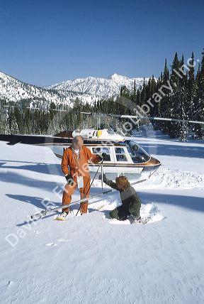 Men conduct a snow depth survey with helicopter in Idaho.