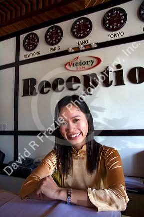 Hotel receptionist at the Victory Hotel in Hue, Vietnam.