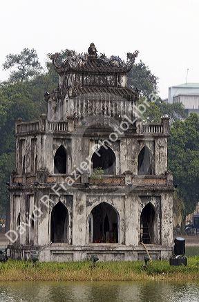 Thap Rua or the Tortoise Tower in the center of Hoan Kiem Lake in Hanoi, Vietnam.