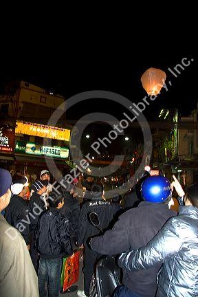 Vietnamese people celebrate Tet by releasing Sky Lanterns in Hanoi, Vietnam.