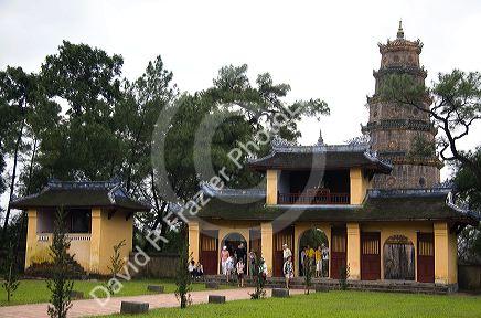 Religious buildings within the grounds of the Thien Mu Pagoda in Hue, Vietnam.