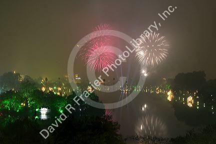 Firework display over a smoky Hoan Kiem Lake for Tet festivities in Hanoi, Vietnam.