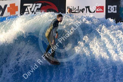 Man surfing on a man made wave machine at Mission Beach, San Diego, Southern California, USA.