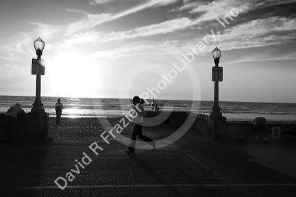 Jogger at sunset on Mission Beach in San Diego, Southern California, USA.