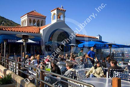 People dine outdoors in the town of Avalon on Catalina Island, California, USA.