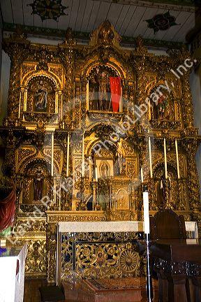 The Golden Altar inside the Father Serra's Church at Mission San Juan Capistrano, California, USA.