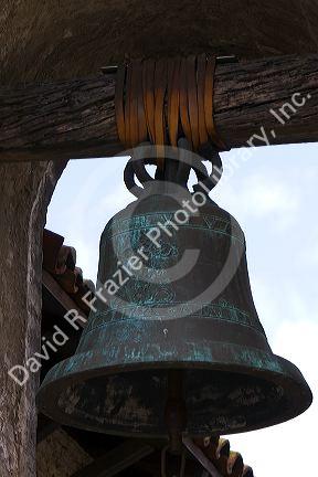 Bell from The Great Stone Church bell tower at the Mission San Juan Capistrano, California, USA.