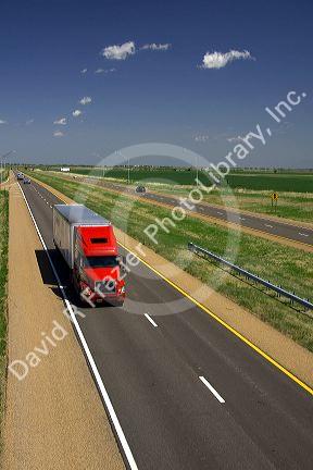 Long haul truck traveling on Interstate 70 in Russell County, Kansas, USA.