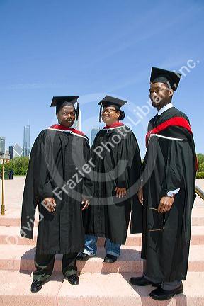 Multi ethnic college graduates celebrate the occasion in Grant Park, Chicago, Illinois, USA.