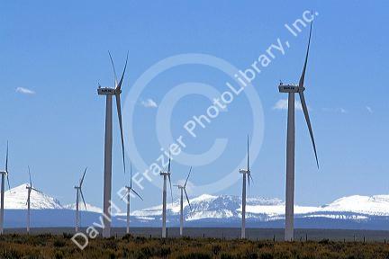 Wind generators amd Uinta Mountain Range along Interstate 80 east of Evanston, Wyoming, USA.