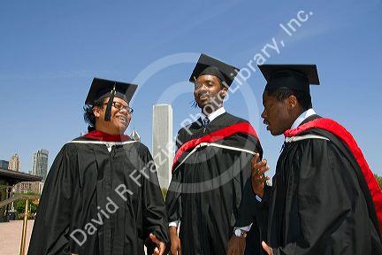 Multi ethnic college graduates celebrate the occasion in Grant Park, Chicago, Illinois, USA.